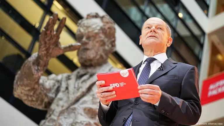 Scholz to hand over power in Germany to sound of feminist anthem Respect