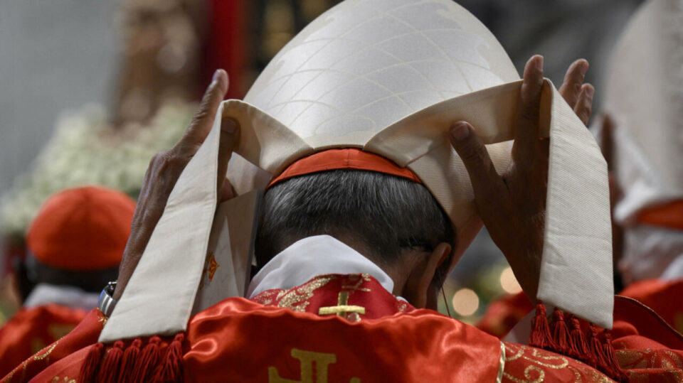 World awaits chimney smoke as conclave starts to elect new pope – live