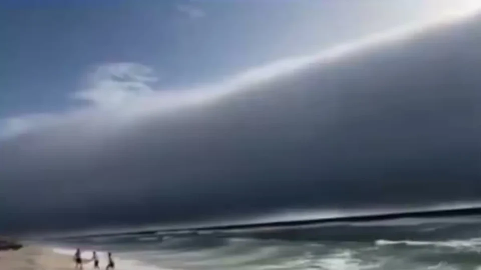 Beachgoers on Greek island watch wildfire burn after intense heatwave – video